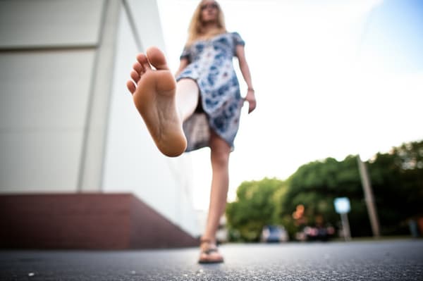 20 year old tan blonde woman wearing Teva sandals